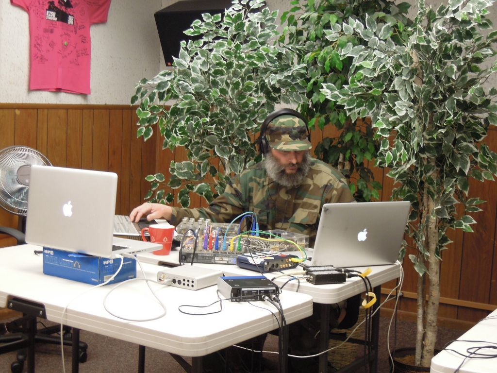 Brian B. James opened the 24-hour Day of Noise. The potted trees, collected from around the station, were set up in the studio for the sake of the webcast, which we ran on UStream throughout the day/night.