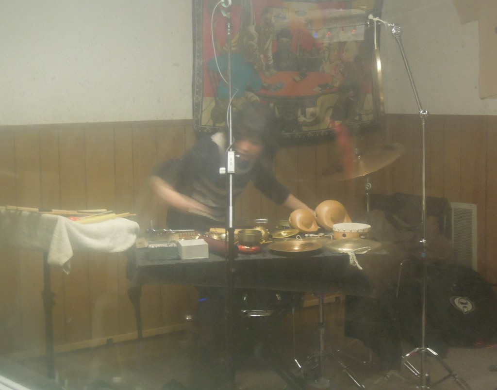 Revenant percussionist Nava Dunkelman, captured through the hazy Studio A window.